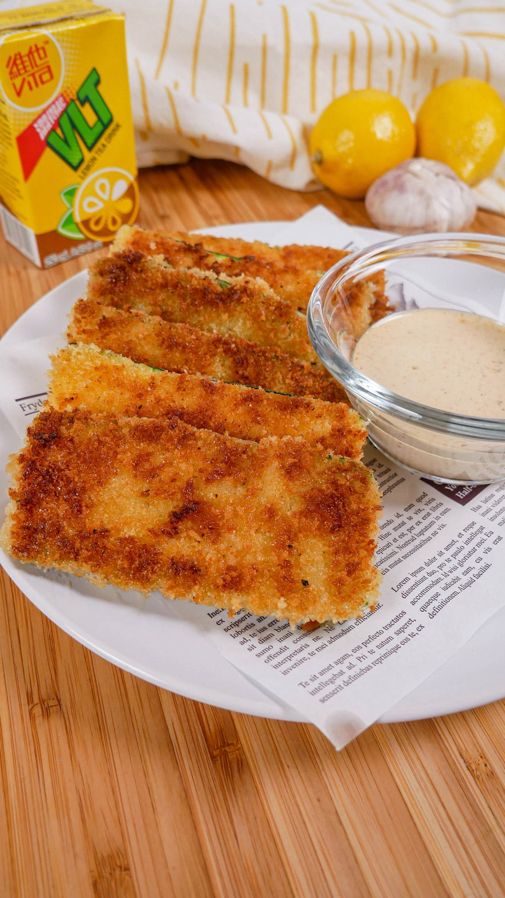 zucchini katsu on plate with garlic lemon dipping sauce